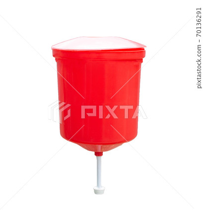 Red rustic washbasin for hands on a white background, isolate, close-up 70136291