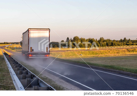 Emergency braking of a loaded truck on dry asphalt. Safety concept and stopping distance with ABS, copy space Emergency braking of a loaded truck on dry asphalt. Safety concept and stopping distance with ABS, copy space 70136546