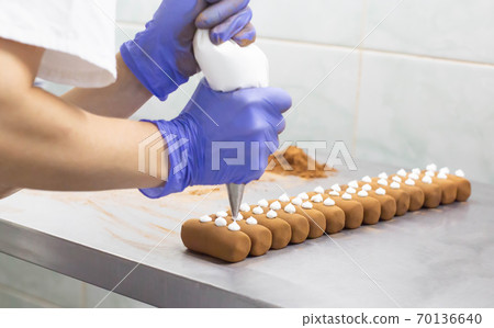 Confectionery production of chocolate cake potato with cocoa, hand made cake Confectionery production of chocolate cake potato with cocoa, hand made cake 70136640