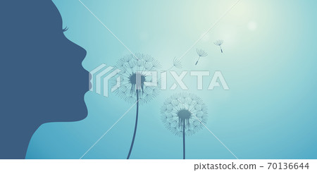 girl blows dandelion silhouette on blue sky background girl blows dandelion silhouette on blue sky background 70136644