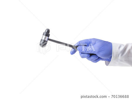 Neurological hammer in the hand of a neurologist doctor on a white background, isolate, instrument Neurological hammer in the hand of a neurologist doctor on a white background, isolate, instrument 70136688