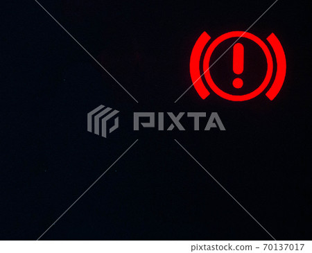 Red danger sign on the car panel. Concept for alerting the driver to a vehicle malfunction, copy space for text, attention Red danger sign on the car panel. Concept for alerting the driver to a vehicle malfunction, copy space for text, attention 70137017