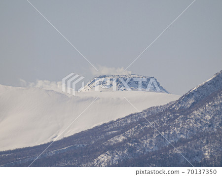Mt. Tarumae over the snowy mountains 02 70137350