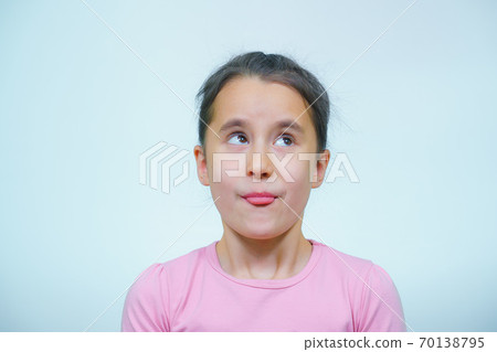 portrait of a girl who makes grimaces. portrait of a girl who makes grimaces. 70138795