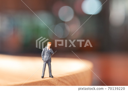 Businessman  standing and thinking with colorfull background. 70139220