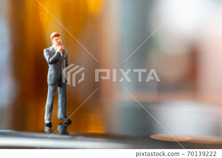 Businessman  standing and thinking with colorfull background. 70139222