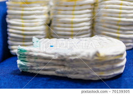 A lot of diapers on the sofa 70139305