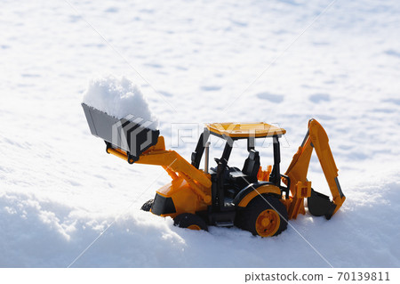 tractor toy removes snow out of the way tractor toy removes snow out of the way 70139811