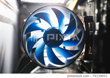 blue cpu cooler inside PC case, shiny light background 70139851