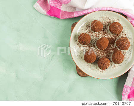 Protein energy balls with cocoa and seeds Protein energy balls with cocoa and seeds 70140767