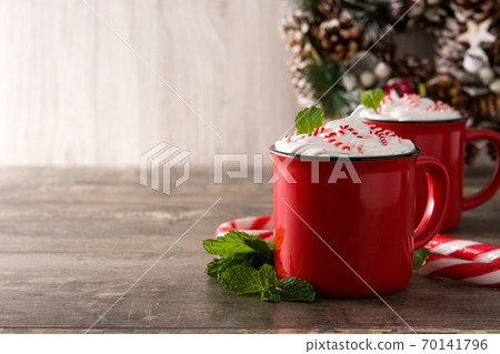 Peppermint coffee mocha for Christmas on wooden table. Copy space 70141796
