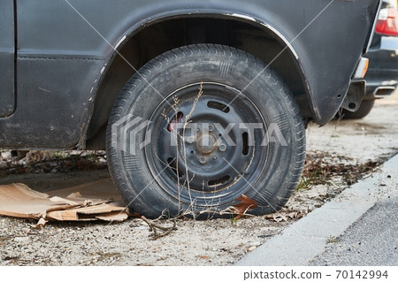 Flat Tire on abandoned wreck Flat Tire on abandoned wreck 70142994