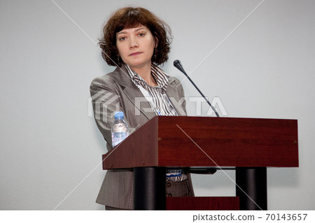 Public speaker giving talk at Business Event Public speaker giving talk at Business Event 70143657