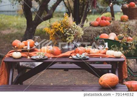Fall themed holiday table setting arrangement for a seasonal party, banner, toned 70144032