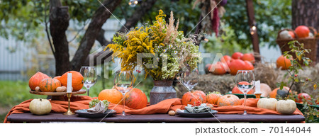 Fall themed holiday table setting arrangement for a seasonal party, banner Fall themed holiday table setting arrangement for a seasonal party, banner 70144044