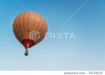 Hot air balloon in the blue sky 70144628
