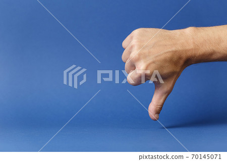 Clenched hand with thumb pointing down disapproval 70145071