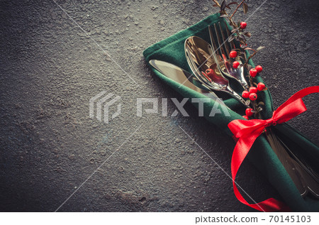 Christmas festive table setting with xmas decorations. Christmas background in rustic stile. Christmas festive table setting with xmas decorations. Christmas background in rustic stile. 70145103