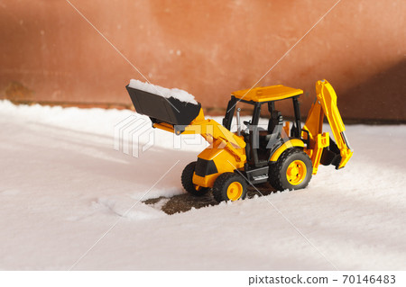 tractor toy removes snow out of the way tractor toy removes snow out of the way 70146483