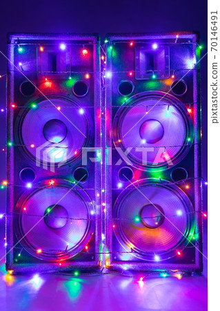 electric guitar with festive Christmas lights and music speakers 70146491