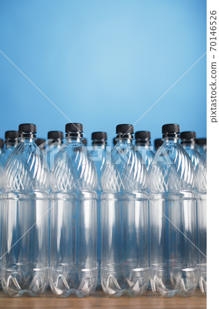 empty plastic bottles on blue background empty plastic bottles on blue background 70146526