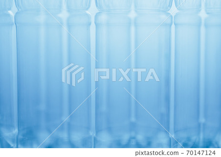empty plastic bottles blue abstract background, close-up view empty plastic bottles blue abstract background, close-up view 70147124