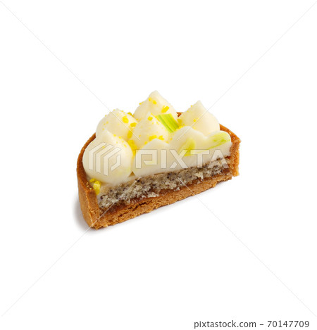 Half of mini tart with cream isolated on a white 70147709