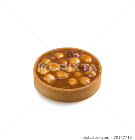 Mini tart with caramel and hazelnut isolated on a white 70147710