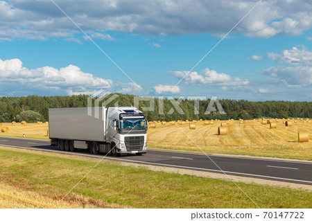 White trailer on the highway 70147722