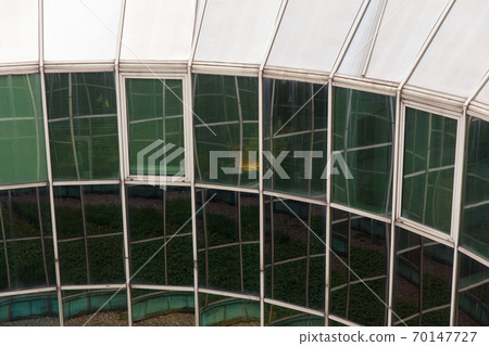 Rounded industrial building wall with urban Rounded industrial building wall with urban 70147727