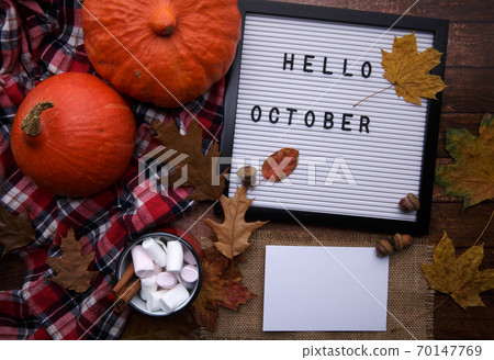 board with the inscription postcard and cocoa on the table with pumpkins board with the inscription postcard and cocoa on the table with pumpkins 70147769