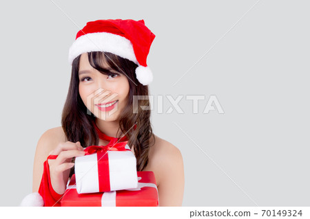 Beautiful portrait young asian woman happy holding lot of gift box with excited in xmas holiday. Beautiful portrait young asian woman happy holding lot of gift box with excited in xmas holiday. 70149324