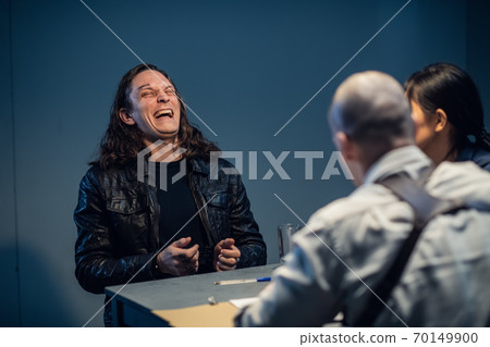 Experienced criminal laughs in the face of investigators during interrogation 70149900