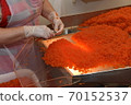 Preparing salmon caviar in the fishing processing plant 70152537