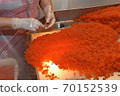 Preparing salmon caviar in the fishing processing plant 70152539