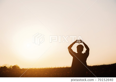 Men in field with silhouette. Men in field with silhouette. 70152640