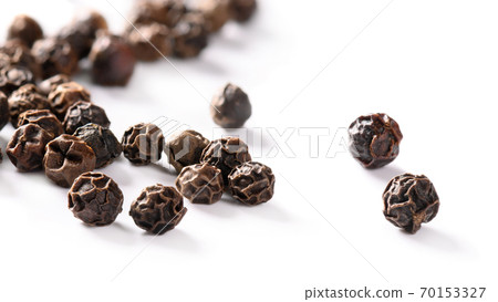 Black peppercorns isolated on white background. 70153327