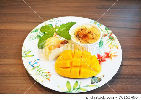 Assorted sweets (cheesecake, creme brulee, mango) 70153466