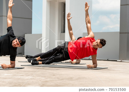 athletic men doing side plank morning workout exercise outdoors athletic men doing side plank morning workout exercise outdoors 70153500
