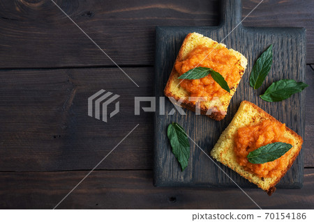 Sandwich with toast and zucchini caviar. Vegetable caviar on bread, a healthy vegetarian snack. copy space Sandwich with toast and zucchini caviar. Vegetable caviar on bread, a healthy vegetarian snack. copy space 70154186