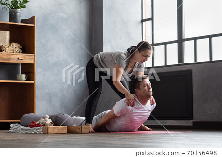 Man practice with private teacher at home class, working out with instructor. Man practice with private teacher at home class, working out with instructor. 70156498