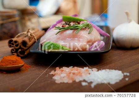 fresh organic chicken breast with herbs and spices fresh organic chicken breast with herbs and spices 70157728