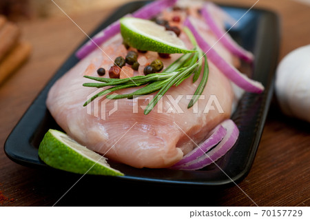 fresh organic chicken breast with herbs and spices 70157729