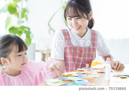 Childcare image: A girl and a childcare worker who work Childcare image: A girl and a childcare worker who work 70158668