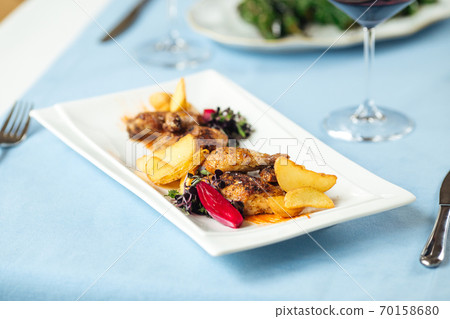 Closeup on grilled chicken with potatoes 70158680