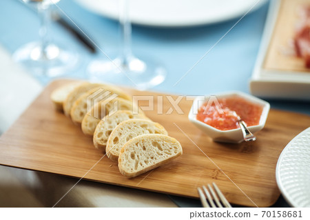 Spanish toasts with tomato sauce on wooden board 70158681