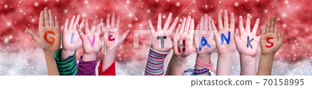 Children Hands Building Word Give Thanks, Red Christmas Background Children Hands Building Word Give Thanks, Red Christmas Background 70158995