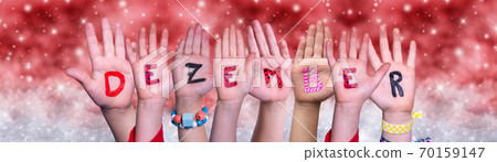 Children Hands Dezember Means December, Red Christmas Background 70159147