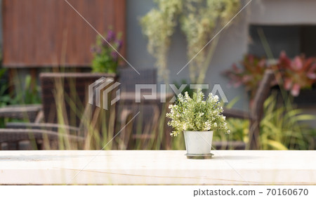 Close - up of flower pot put on outdoor table with many space for ad your products Close - up of flower pot put on outdoor table with many space for ad your products 70160670