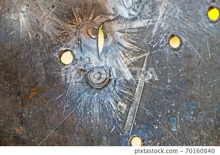 Bullet holes on on armored steel 70160840